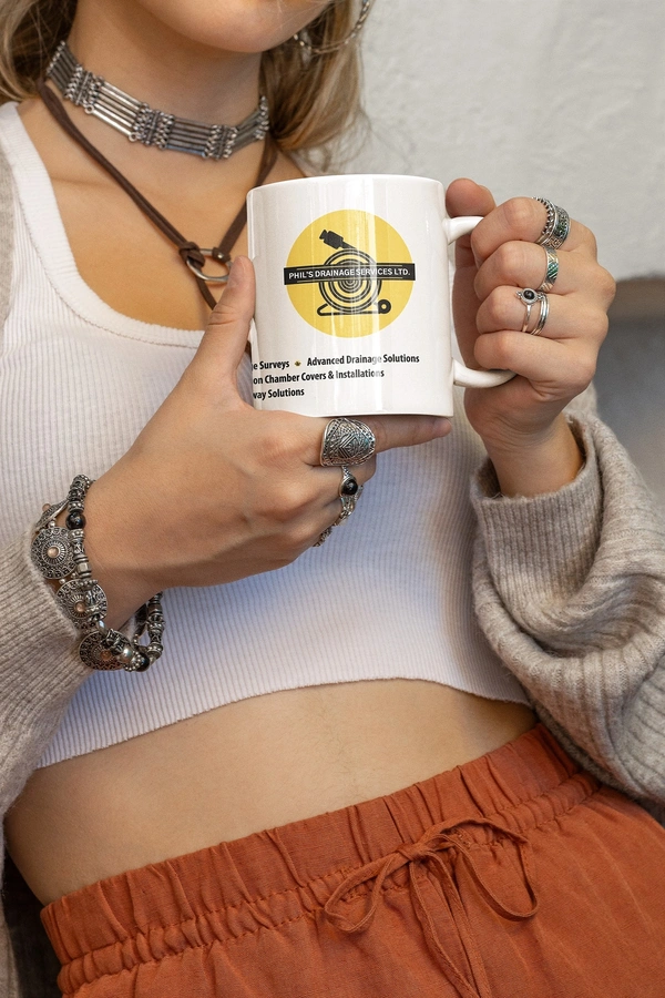 Mockup - Of - A - Woman - In - Boho - Garments - Holding - An - 11 - Oz - Coffee - Mug - Phils Drai